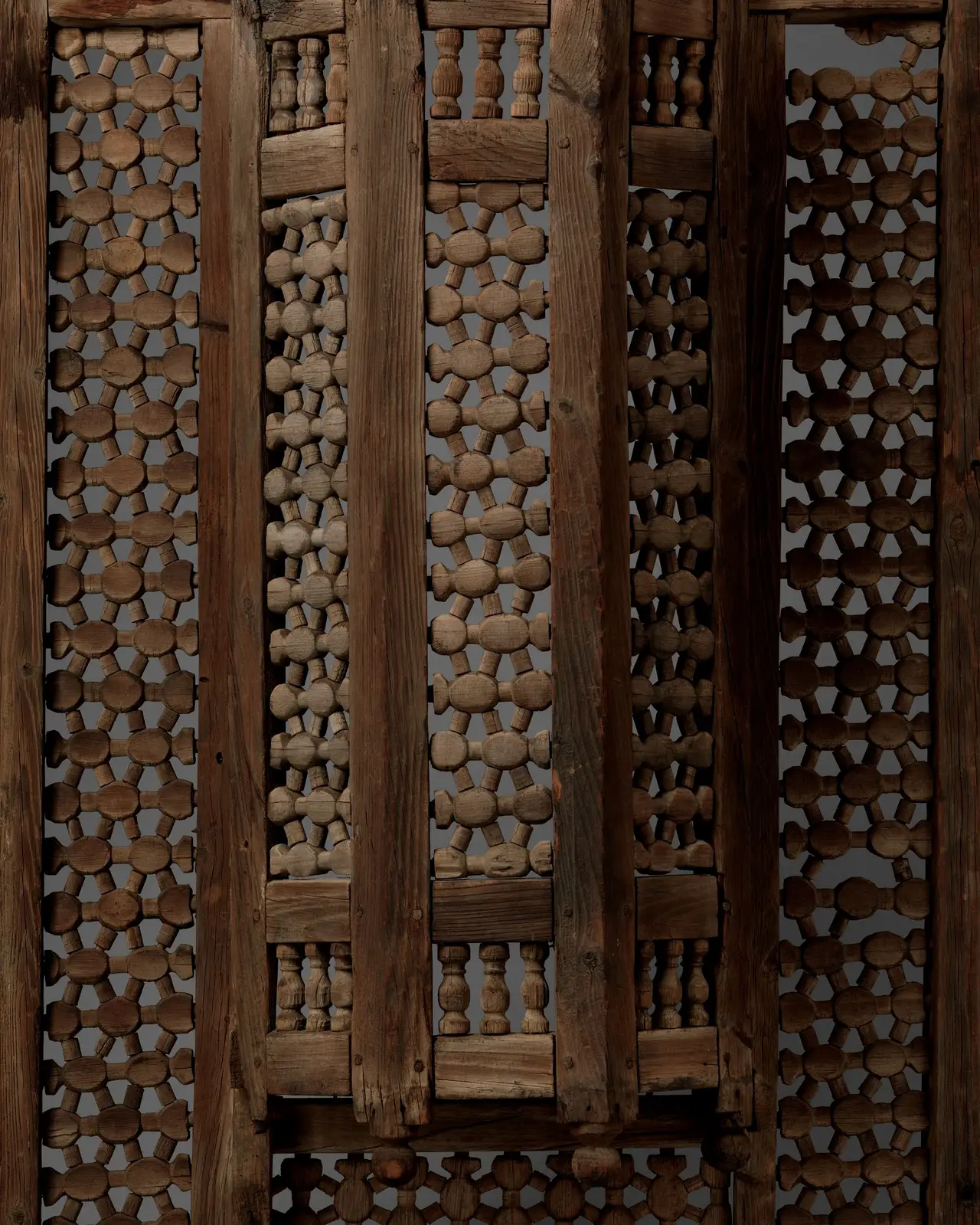 Close view of a carved wooden mashrabiya lattice screen